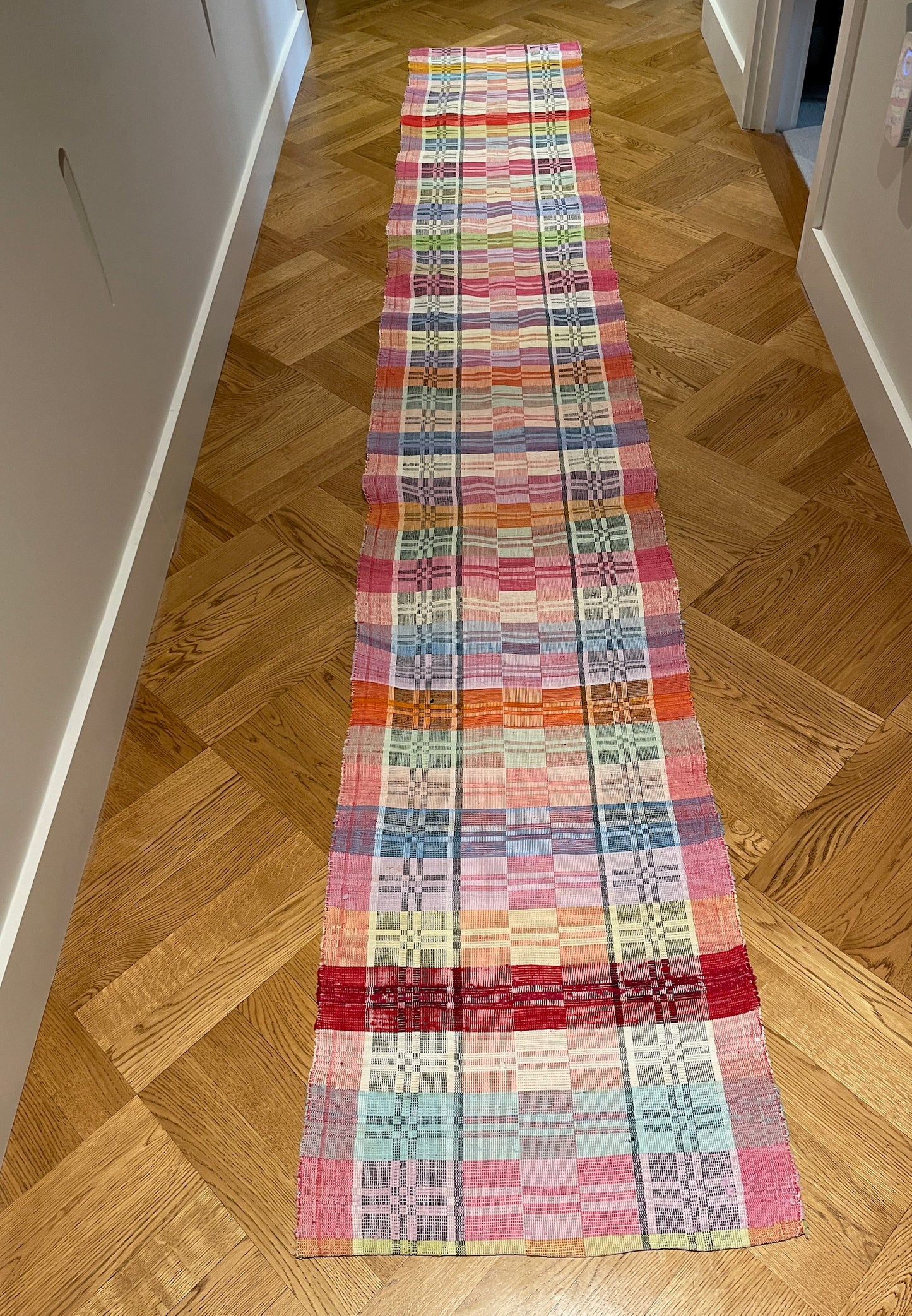 
                  
                    long floor runner in rainbow red pink yellow colours cotton vintage rag rug washable mat checked
                  
                