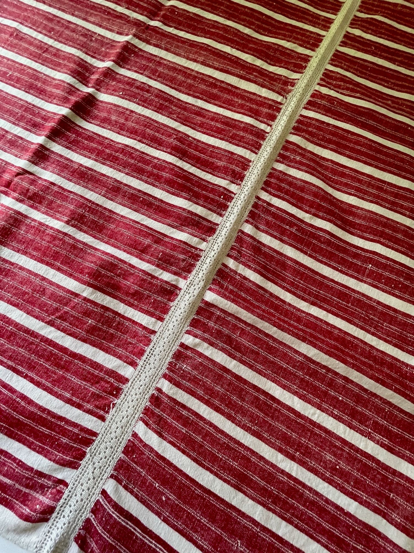 
                  
                    red white stripe woven fabric for upholstery or sewing projects. East European folk textile rustic.
                  
                