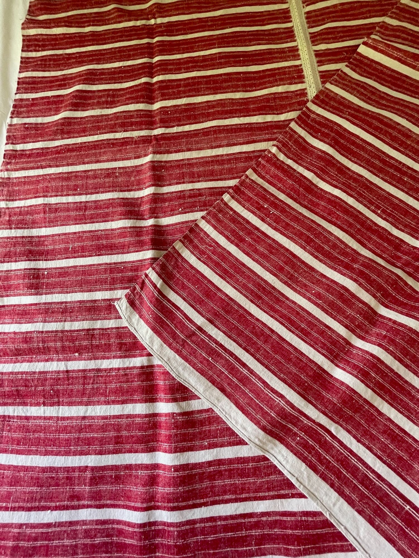 
                  
                    red white stripe woven fabric for upholstery or sewing projects. East European folk textile rustic.
                  
                