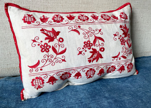vintage hungarian folk textile red embroidered cushion on cream linen for sofa or chair