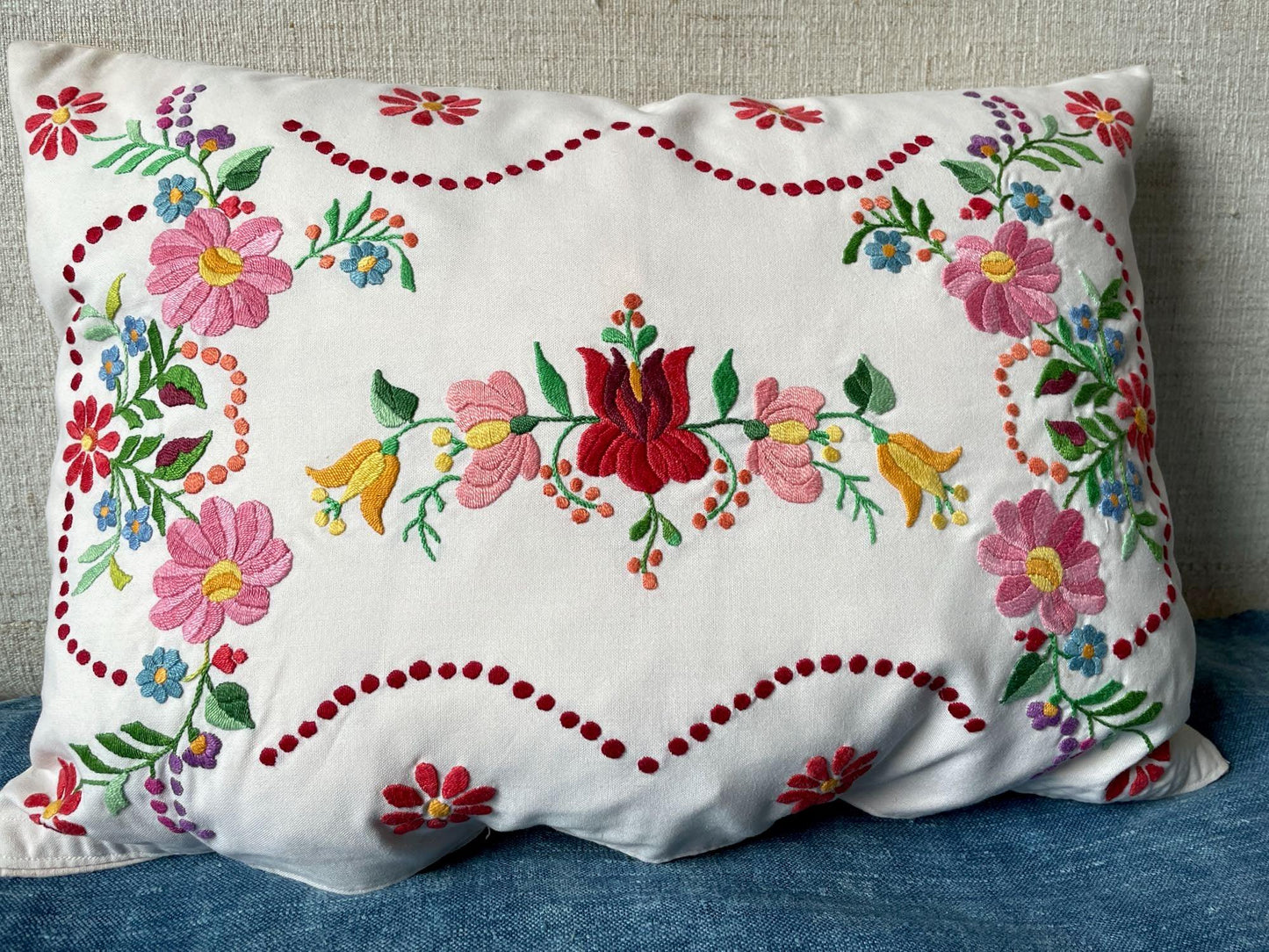 
                  
                    pretty pink red floral embroidered cushion hand stitched pillow vintage hungarian folk art textile
                  
                