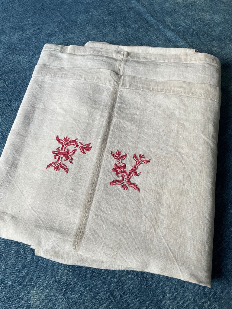 antique french linen sheet in natural creamy linen embroidered FV in raspberry red cross stitch